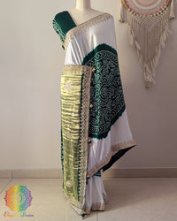White and green gaji silk Rasmandal saree on mannequin showing full drape and gota patti border work