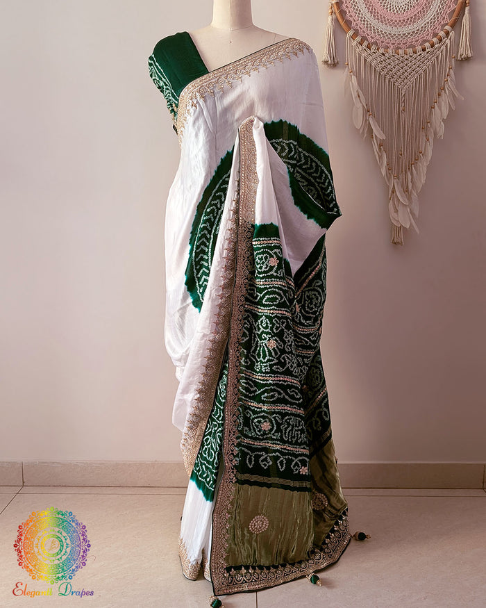 Green palla on white and green gaji silk saree highlighting Rasmandal motifs and gota patti detailing