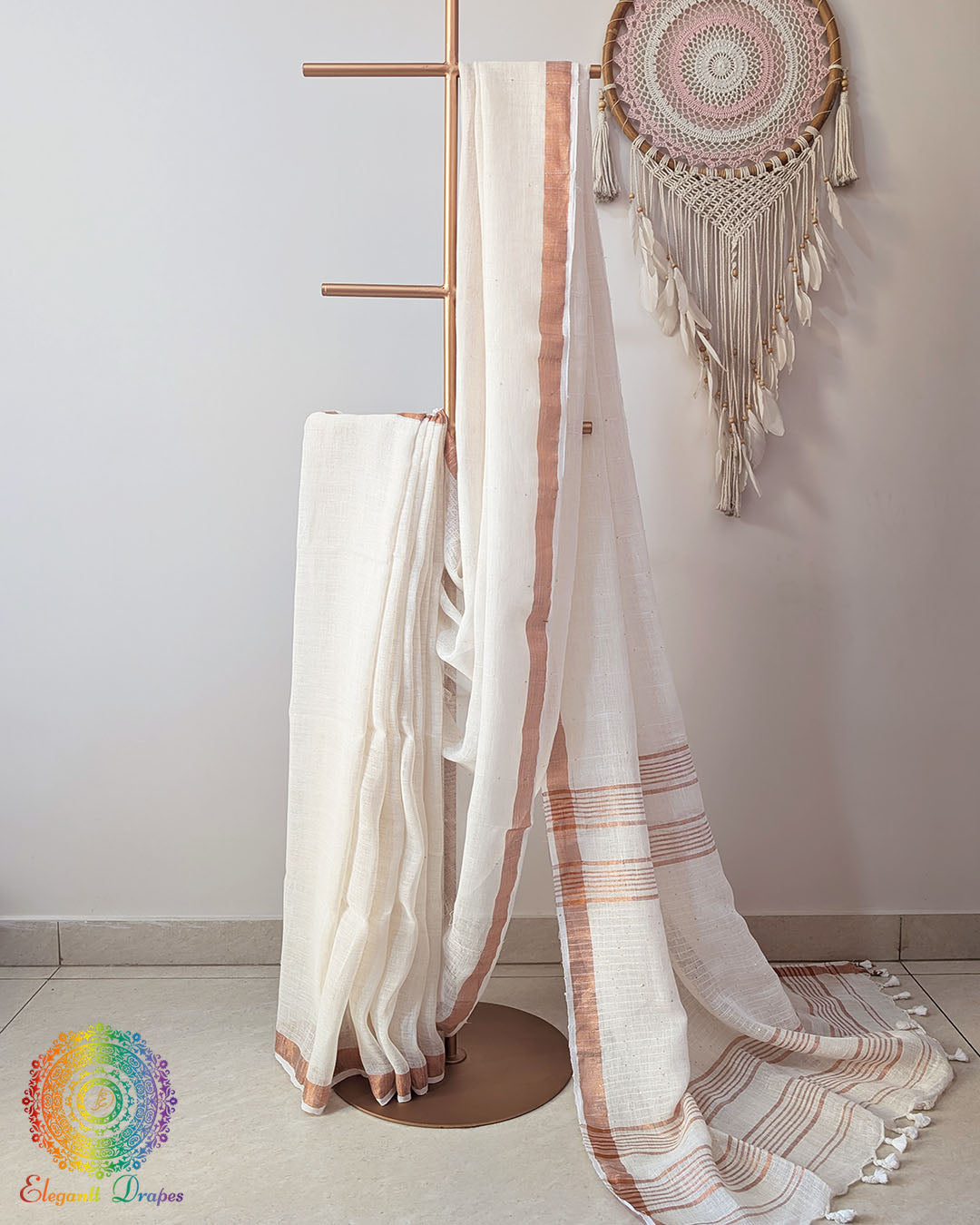 Ivory white linen saree with sequins on mannequin showing complete drape
