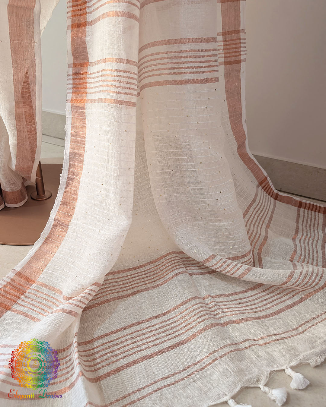 Sequin detail close up on ivory white linen saree highlighting subtle shimmer