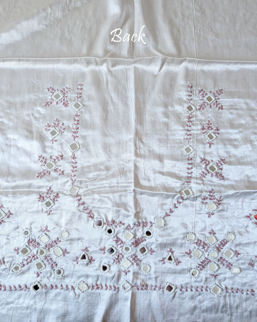 Close-up of Kutch mirror work on the back of White Mashru Silk Blouse Piece