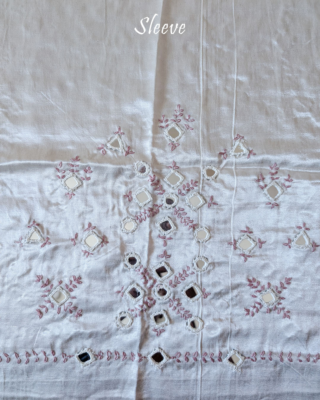 Close-up of Kutch mirror embroidery on sleeve of White Mashru Silk Blouse Piece