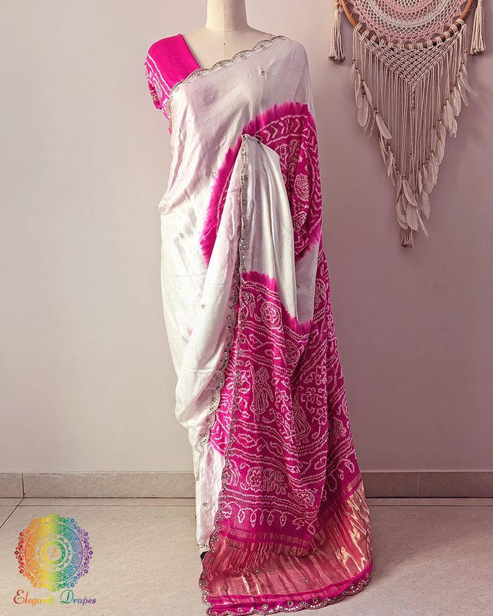 White pink gaji silk saree palla on mannequin highlighting Rasmandal motifs and gota patti detailing