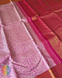 White Kanjivaram saree body close up highlighting pink thread weaving