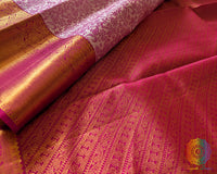 Pink palla close up showcasing intricate zari weaving on Kanjivaram silk saree