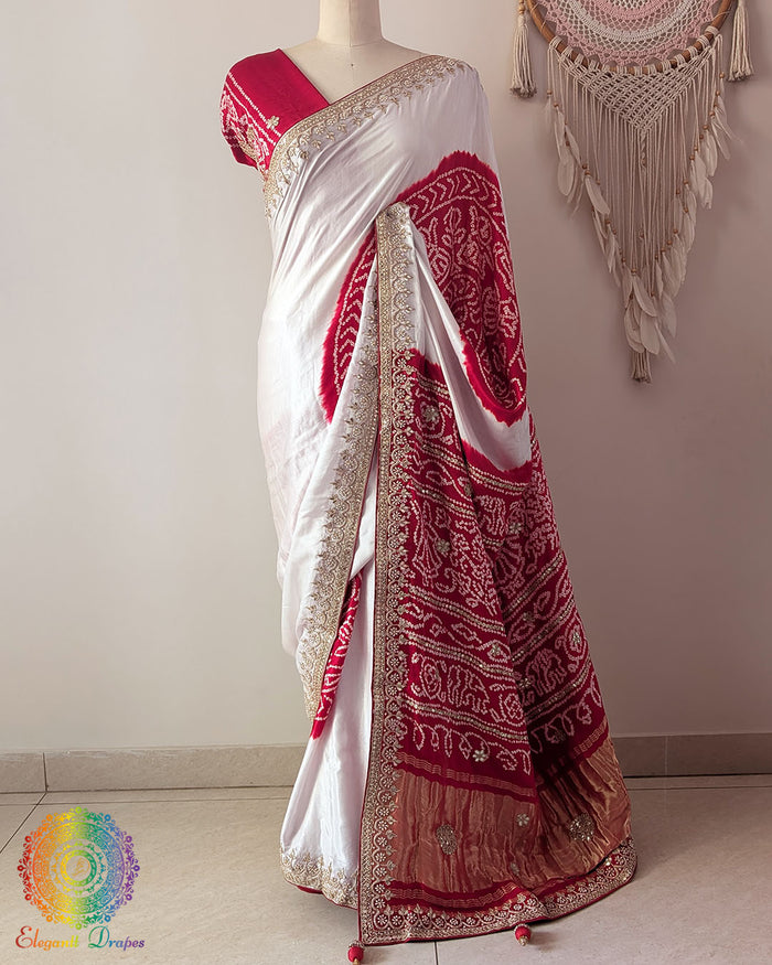 Red palla on white and red gaji silk saree highlighting Rasmandal motifs and gota patti detailing