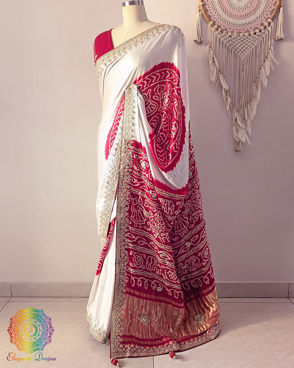 Side angle view of white and red gaji silk Rasmandal saree showcasing elegant silk drape