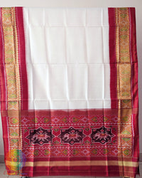 White Red Handwoven Mulberry Silk Rajkot Patola Saree – Full Saree View displaying the complete saree with its pristine white body, rich red palla and coordinated red border, showcasing the natural sheen and graceful drape of mulberry silk.