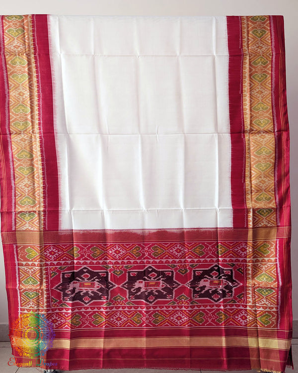 White Red Handwoven Mulberry Silk Rajkot Patola Saree – Full Saree View displaying the complete saree with its pristine white body, rich red palla and coordinated red border, showcasing the natural sheen and graceful drape of mulberry silk.