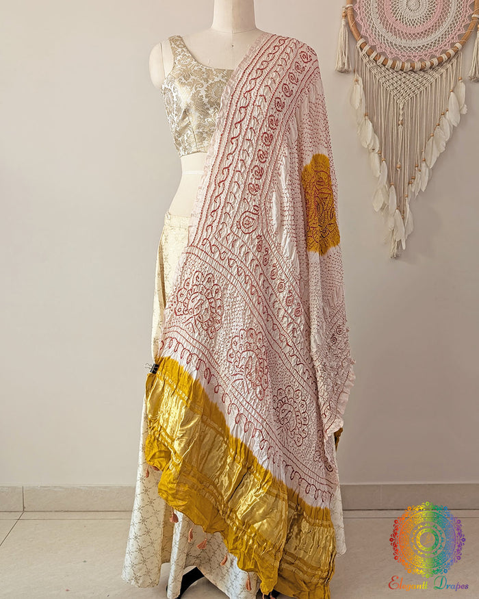 White gaji silk bandhani dupatta with yellow palla traditional tie and dye Elegantt Drapes