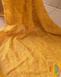 Close-up of Chikankari threadwork on the pallu of Yellow Mul Cotton Saree