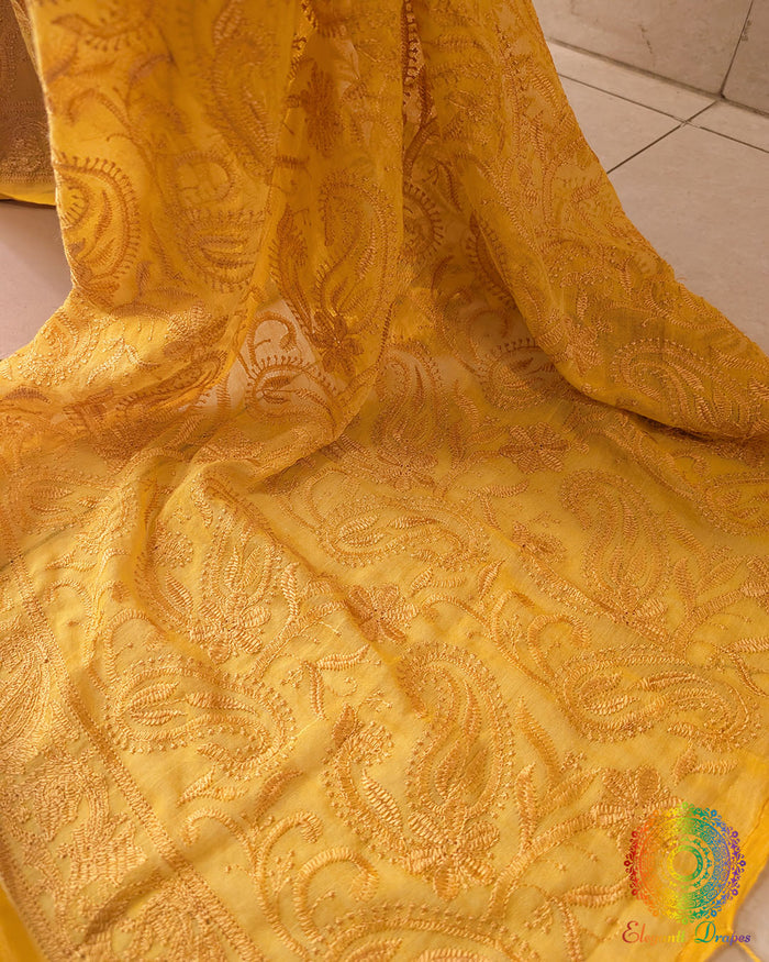 Close-up of Chikankari threadwork on the pallu of Yellow Mul Cotton Saree