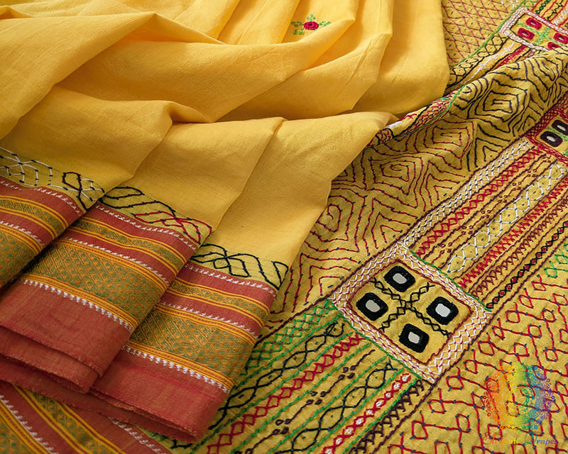 Close up of yellow Ilkal cotton saree with Lambani embroidery