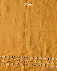 Sleeve detail of the Mustard Yellow Kala Cotton Kutch Mirror Handwork blouse piece, highlighting the real mirror embellishments, decorative threadwork and warm mustard yellow fabric.