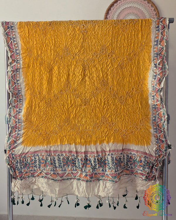 Yellow Muga Silk Dupatta with Bandhani body and hand-painted Madhubani artwork border