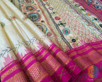 Pink border close up on pale yellow Ilkal saree highlighting weave and finish