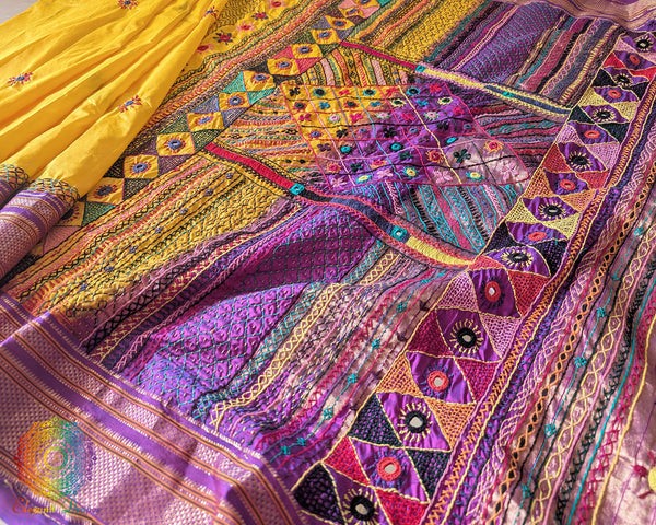 Yellow Lambani embroidered Ilkal silk saree full layout view with purple accents