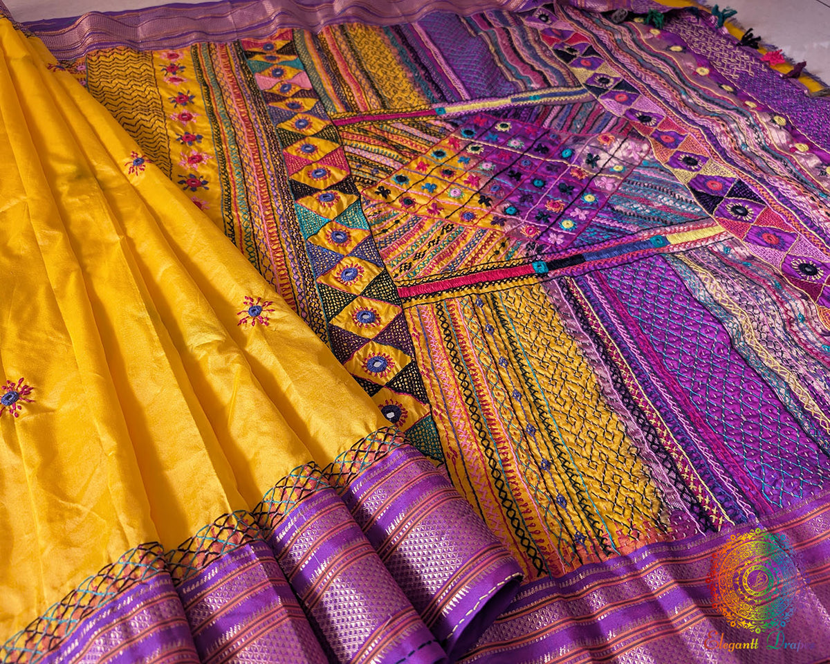 Detailed view of handcrafted embroidery on purple palla of Ilkal silk saree