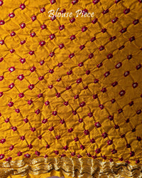 Matching blouse piece with coordinated Bandhani design and Nakshi border detailing