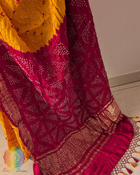 Close up of traditional Bandhani motifs on mustard yellow pure gaji silk saree