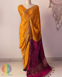 Mustard yellow pure gaji silk Bandhani saree on mannequin with red palla and Nakshi woven border