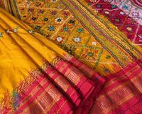 Traditional embroidered motif detail on yellow Ilkal silk saree