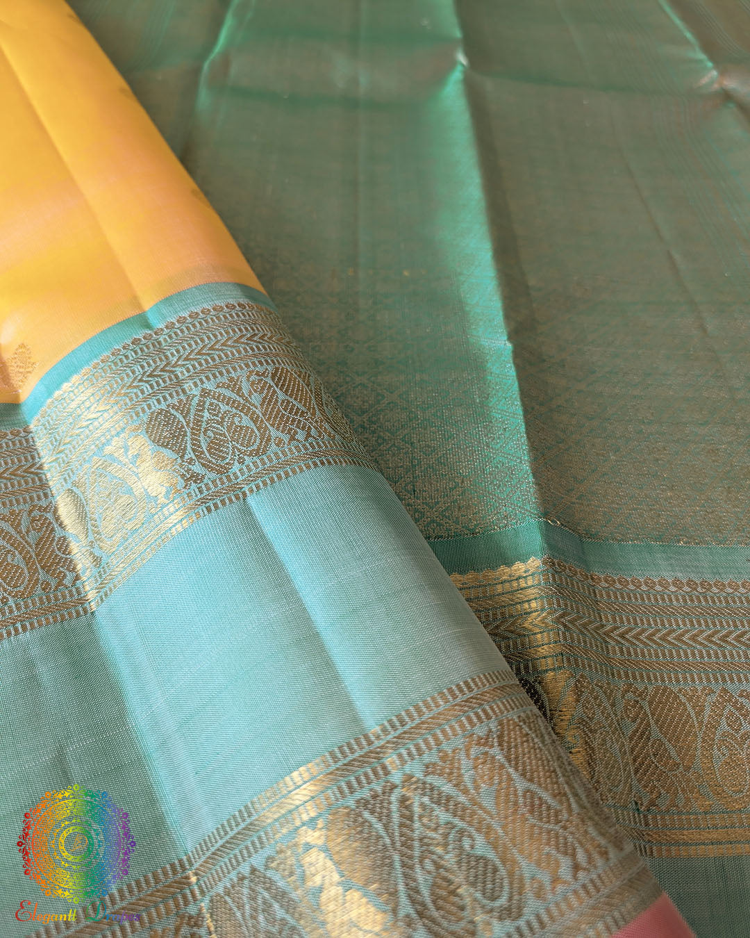 Pale Yellow Kanjivaram Silk Saree – Gold Zari Boota Detail highlighting the delicate gold zari motifs woven across the yellow silk body, adding a subtle traditional shimmer.