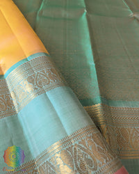 Pale Yellow Kanjivaram Silk Saree – Gold Zari Boota Detail highlighting the delicate gold zari motifs woven across the yellow silk body, adding a subtle traditional shimmer.