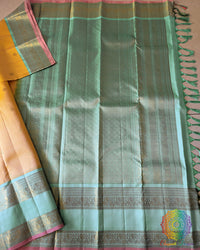 Yellow Pure Kanjivaram Silk Saree – Open Full View displaying the complete saree with its pale yellow body adorned with gold zari bootas and a contrasting sea green palla and border.
