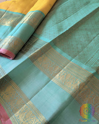 Yellow Kanjivaram Handloom Silk Saree – Detailed Border View highlighting the sea green border, intricate zari weaving and fine silk texture of this traditional South Indian saree.